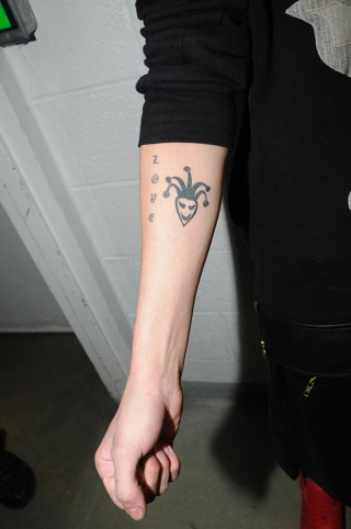 Illustration for article titled Justin Bieber's Tattoos Documented by the Miami PD: A Visual Analysis